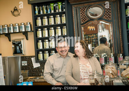 Portrait of mature cafe owning couple in cafe kitchen Stock Photo