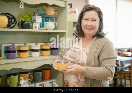 Portrait of mature female business owner in cafe Stock Photo