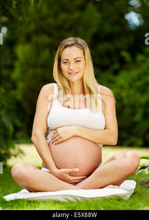 Pregnant woman Yoga Stock Photo