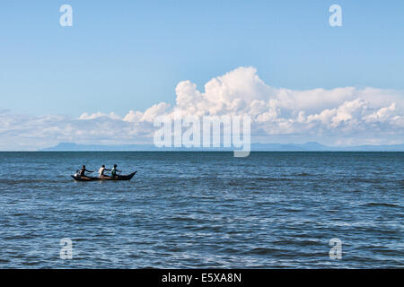 Three fishermen begin their day's work on Lake Malawi. Stock Photo