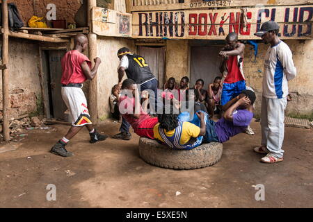 Kampala, Uganda. 10th Dec, 2013. With just one pair of gloves, one pair of shoes and some dirty bandages, girls and women train 2.5 hours every day for a new destiny, for being in a better situation one day. © Johan Bauza/ZUMA Wire/ZUMAPRESS.com/Alamy Live News Stock Photo