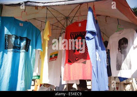 Souvenir T shirts depicting the face of Aung San Suu Kyi for sale on Bogyoke Aung San Road, central Yangon, Myanamar (Burma). Stock Photo