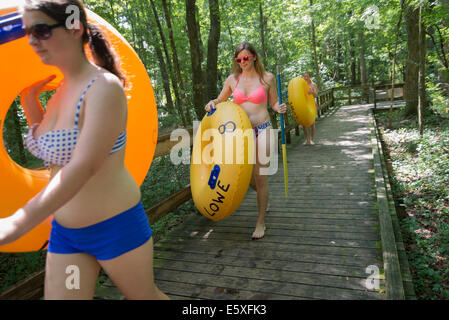 People walking down to one of the starting points for tubing down the Ichetucknee River in North Florida. Stock Photo