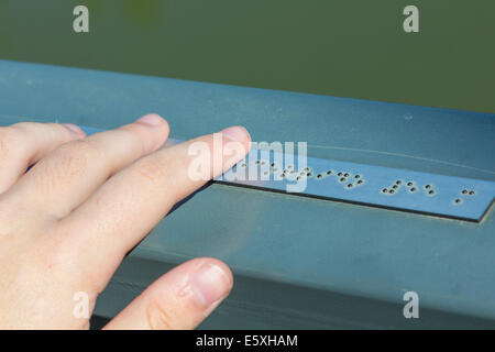 Young hand reading braille writing Stock Photo