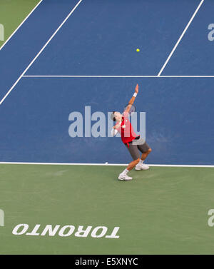 Toronto, Canada. 07th Aug, 2014. Milos Raonic of Canada serves during the third round of men's singles against Julien Benneteau of France at the 2014 Rogers Cup in Toronto, Canada, Aug. 7, 2014. Milos Raonic won the match 2-1. Credit:  Xinhua/Alamy Live News Stock Photo