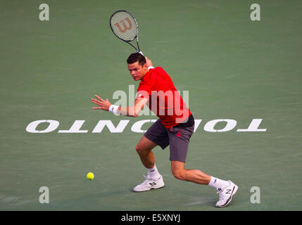 Toronto, Canada. 07th Aug, 2014. Milos Raonic of Canada returns the ball during the third round of men's singles against Julien Benneteau of France at the 2014 Rogers Cup in Toronto, Canada, Aug. 7, 2014. Milos Raonic won the match 2-1. Credit:  Xinhua/Alamy Live News Stock Photo