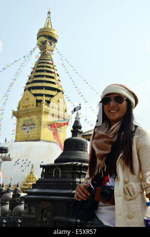 Thai women in Swayambhunath Temple or Monkey Temple with Buddha eyes or ...
