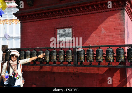 Thai woman spinning prayer wheels in Swayambhunath Temple or Monkey ...