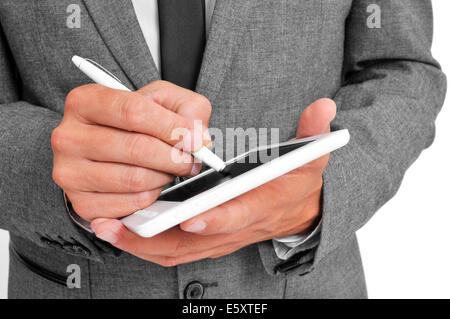 a businessman using a stylus pen in his tablet Stock Photo