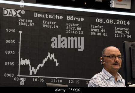 Frankfurt Main, Germany. 08th Aug, 2014. The stock brokers watch the stock market development on the national and international markets on the floor of the stock market in Frankfurt Main, Germany, 08 August 2014. The German stock index DAX slipped under the 9000 point mark this morning. Photo: BORIS ROESSLER/dpa/Alamy Live News Stock Photo