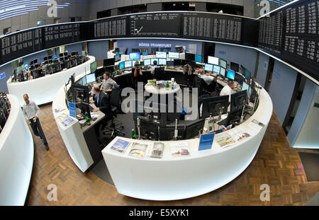 Frankfurt Main, Germany. 08th Aug, 2014. The stock brokers watch the stock market development on the national and international markets on the floor of the stock market in Frankfurt Main, Germany, 08 August 2014. The German stock index DAX slipped under the 9000 point mark this morning. Photo: BORIS ROESSLER/dpa/Alamy Live News Stock Photo