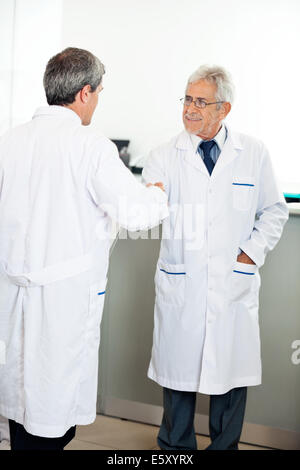 Technicians Shaking Hands Stock Photo