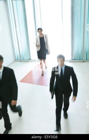 Business professionals arriving for another day of work Stock Photo