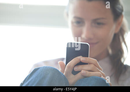 Woman browsing web with smatrphone