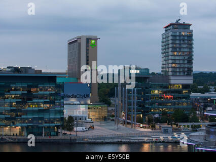 Panorama of Salford Quays and Media City in Manchester, UK at dusk, shot from the top of Quay West. Stock Photo