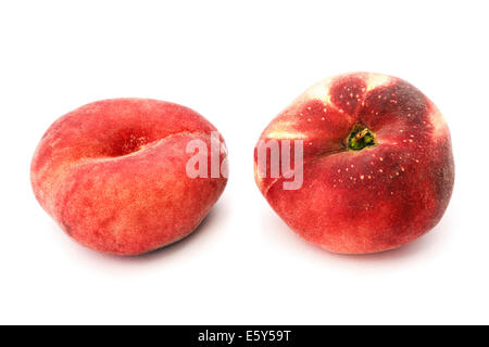 Two Donut (Doughnut), Paraguayo, Saturn or Flat peaches isolated on a white background. Stock Photo