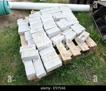 construction site with pile of white bricks Stock Photo - Alamy