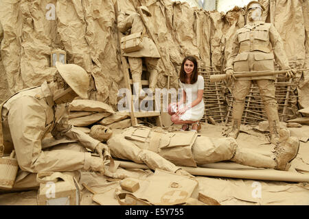 Student Grace Westwood with her life-sized depiction of World War One soldiers made entirely out of brown paper and cardboard. Stock Photo