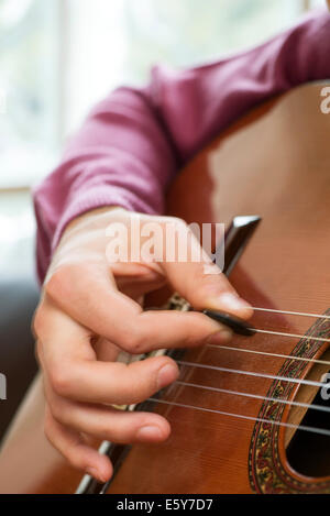 Playing acoustic guitar Stock Photo