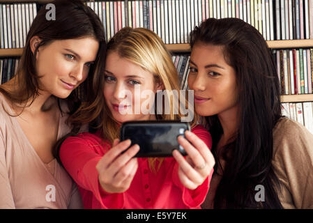 Young women posing together for selfie Stock Photo