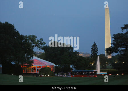 Washington, DC. 5th Aug, 2014. Guests arrive for a dinner in a tent-like temporary building on the occasion of the U.S.-Africa Leaders Summit on the South Lawn of the White House August 5, 2014 in Washington, DC. President Barack Obama is promoting business relationships between the United States and African countries during the three-day U.S.-Africa Leaders Summit, where 49 heads of state are meeting in Washington. Credit: Chip Somodevilla/Pool via CNP -NO WIRE SERVICE- © dpa/Alamy Live News Stock Photo