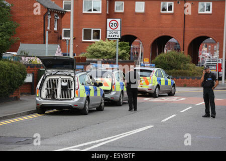 Swansea, Wales, UK. 8th August, 2014. Pictured: Police dog units on stand by. Friday 08 August 2014 Re: Police in Swansea south Wales have surrounded the Meridian Quay tower in the Marina area of the city over unconfirmed reports that a man with a weapon entered the Grape and Olive restaurant on the top floor. Credit:  D Legakis/Alamy Live News Stock Photo