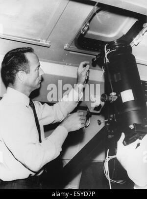 NASA Astronaut Scott Carpenter Inspecting Equipment in Advance of his Journey to View Sun's Corona During Total Eclipse, 1965 Stock Photo