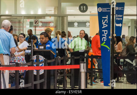 Long lines of air travelers pass through TSA PreCheck as agents check each person's ID at Atlanta International Airport. USA. Stock Photo