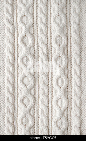 Knit texture of white wool knitted fabric with cable pattern as background Stock Photo