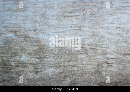 Old wooden background of weathered distressed rustic wood with faded light blue paint showing woodgrain texture Stock Photo