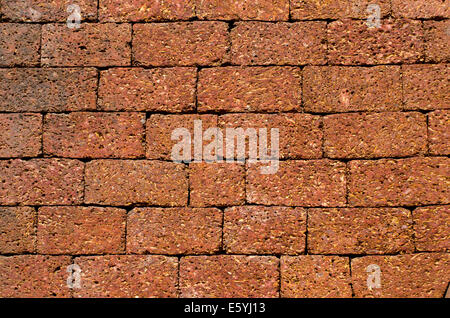 temple big brown brick wall background and texture in Goa, India Stock Photo