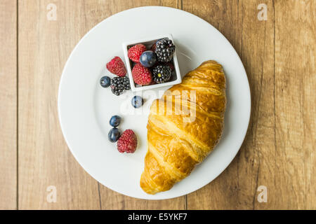 Croissant And Fresh Fruits Breakfast Stock Photo