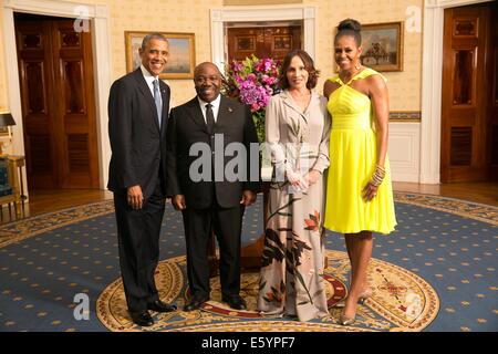 US President Barack Obama and First Lady Michelle Obama pose with Ali Bongo Ondimba, President of the Gabonese Republic, and his wife Sylvia Bongo Ondimba, in the Blue Room of the White House before the U.S.-Africa Leaders Summit dinner August 5, 2014 in Washington, DC. Stock Photo