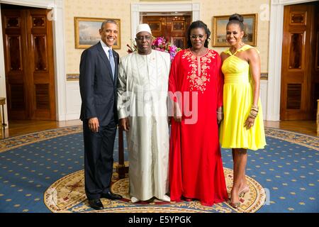 US President Barack Obama and First Lady Michelle Obama pose with Macky Sall, President of the Republic of Senegal, and his wife Marieme Sall, in the Blue Room of the White House before the U.S.-Africa Leaders Summit dinner August 5, 2014 in Washington, DC. Stock Photo