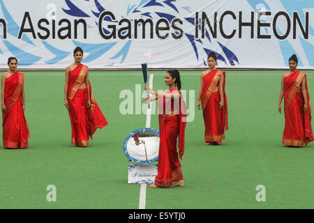 New Delhi, India. 9th August, 2014. The flame for the 17th Asian Games Incheon 2014 is lit during the flame lighting ceremony at New Delhi national stadium in New Delhi, India, Aug. 9, 2014. Credit:  Xinhua/Alamy Live News Stock Photo