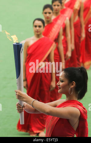 New Delhi, India. 9th August, 2014. The torch carrying the flame for the 17th Asian Games Incheon 2014 is shown during the flame lighting ceremony at New Delhi national stadium in New Delhi, India, Aug. 9, 2014. Credit:  Xinhua/Alamy Live News Stock Photo