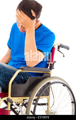 depressed handicapped man sitting on a wheelchair Stock Photo