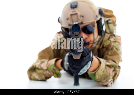 Soldier with rifle against and lying on floor.isolated on white Stock Photo