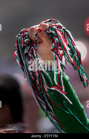 London, UK. 9th August, 2014.  Wristbands made of the Palestinian colours are offered to the tens of thousands marching for Palestine in London. Credit:  Paul Davey/Alamy Live News Stock Photo