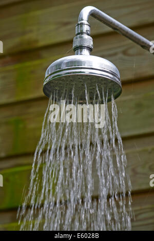 Outdoor Metal Shower Head With Running Water Stock Photo