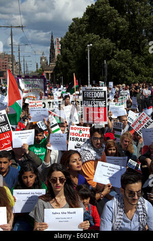 Edinburgh, Scotland, UK. 9th August, 2014. Scottish supporters of Palestinian rights took part in a rally at the Mound and march along Princes Street  in Edinburgh as part of a a day of protest by the Boycott, Divestment and Sanctions (BDS) movement to highlight the situation in Gaza and in Palestine. They also had a sit down in Princes Street for two minutes silence to remember the dead. Stock Photo