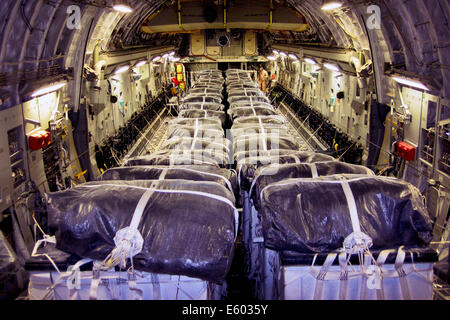 Bundles of bottled water ready for air drop by a U.S. Air Force C-17 Globemaster III during humanitarian relief efforts to aid trapped ethnic minority Iraqis trapped by the ISIL on a mountain in northern Iraq August 8, 2014 at Al Udeid Air Base, Qatar. The 816th Expeditionary Airlift Squadron aircrew, air dropped 40 bundles of water for Iraqi refugees during the mission. Stock Photo
