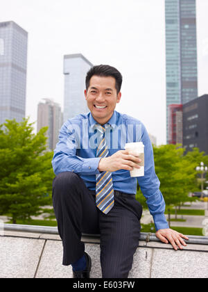 businessman with coffee smiling Stock Photo