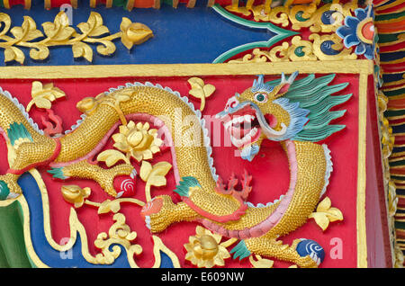 asian buddhist temple ornamental ornate dragon on wall Stock Photo