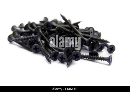 Black Brass Screws With a Philips Crosshead Isolated On White Stock Photo