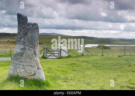 Megalithic stone of 3000 bc on the Isle of Lewis and Harris, Outer Hebrides, Scotland with sheep gate 'please close the gate' Stock Photo