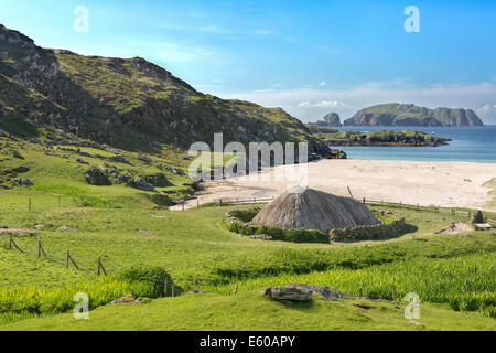 Ancient blackhouse or celtic croft preserved and restorend on a beach on Lewis in the Ouder Hebrides of Scotland Stock Photo