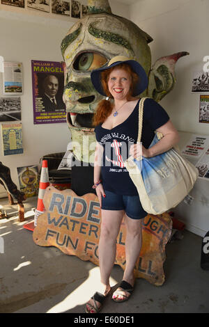 Brooklyn, New York, USA. 9th Aug, 2014. TRACIE DEE, of Brooklyn, poses next to Spook-A-Rama Cyclops at The Fourth Annual History Day at Deno's Wonder Wheel Amusement Park and Coney Island History Project. Credit:  Ann Parry/ZUMA Wire/Alamy Live News Stock Photo