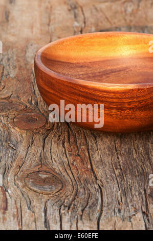 Empty handmade traditional brown bowls on wooden background. Closeup. Stock Photo