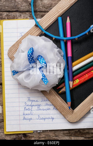 notebook,pencil,bow schoolgirl first year pupil Stock Photo